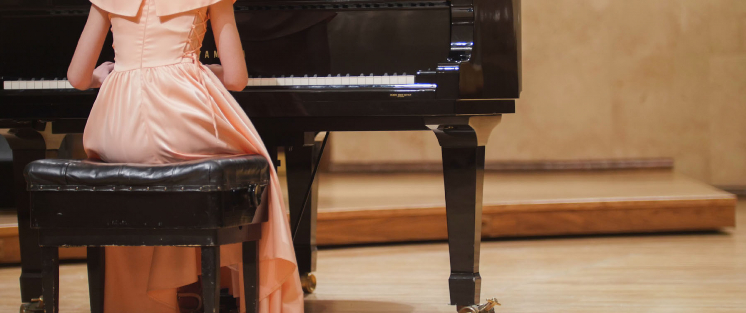Close,Up,View,Of,Cute,Teenager,Girl,Plays,Piano,In